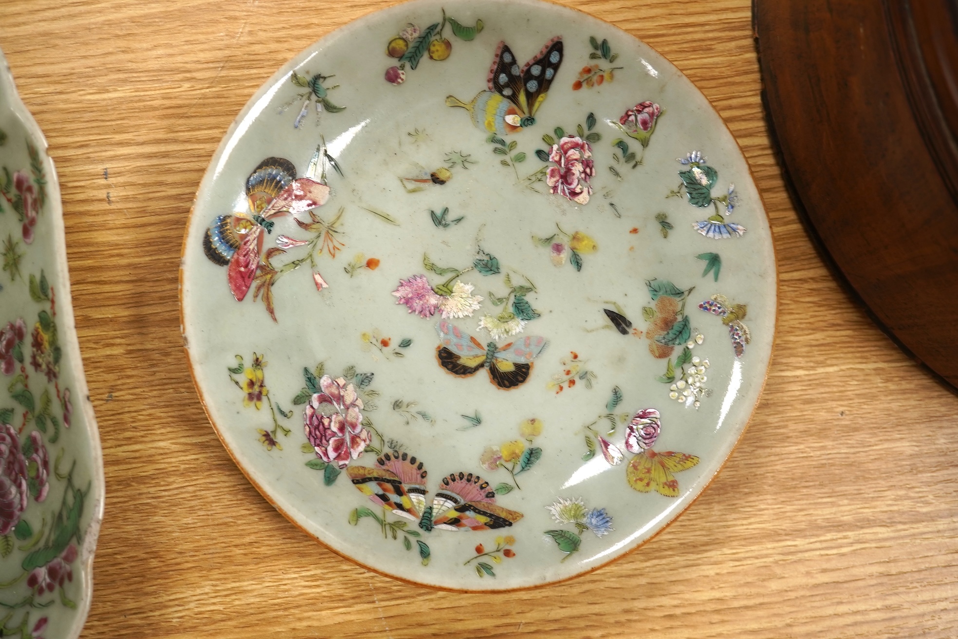 Four 19th century Chinese famille rose celadon ground dishes, largest 25cm